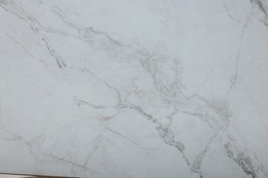 Photo of Texture of white marble surface as background, top view
