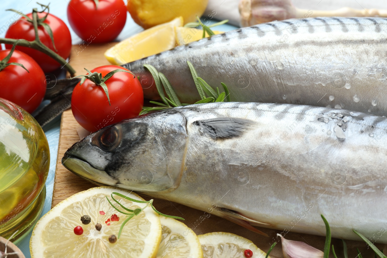 Fresh raw mackerels and spices on table, closeup. Seafood delicacies Photo of Fresh raw mackerels and spices on table, closeup. Seafood delicacies