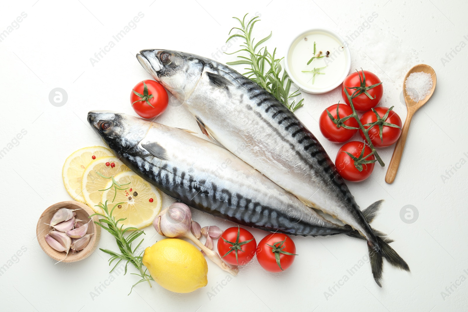 Fresh raw mackerels and spices on white table, flat lay. Seafood delicacies Photo of Fresh raw mackerels and spices on white table, flat lay. Seafood delicacies