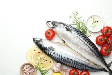 Photo of Seafood delicacies. Fresh raw mackerels and spices on white table, flat lay. Space for text