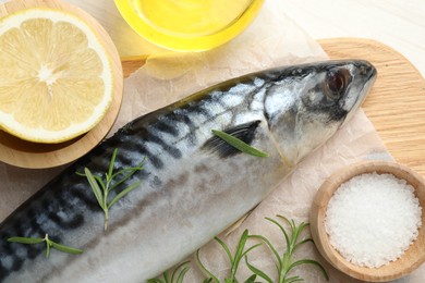Photo of Fresh raw mackerel and spices on table, flat lay. Seafood delicacies