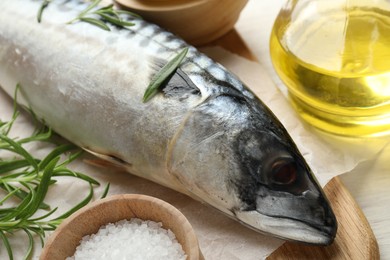 Photo of Fresh raw mackerel and spices on table, closeup. Seafood delicacies
