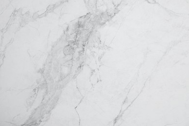 Photo of Texture of white marble surface as background, top view