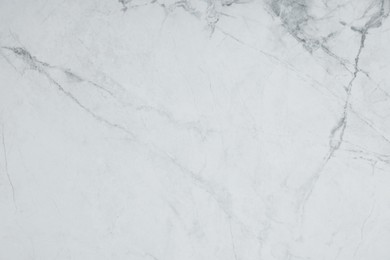 Photo of Texture of white marble surface as background, top view