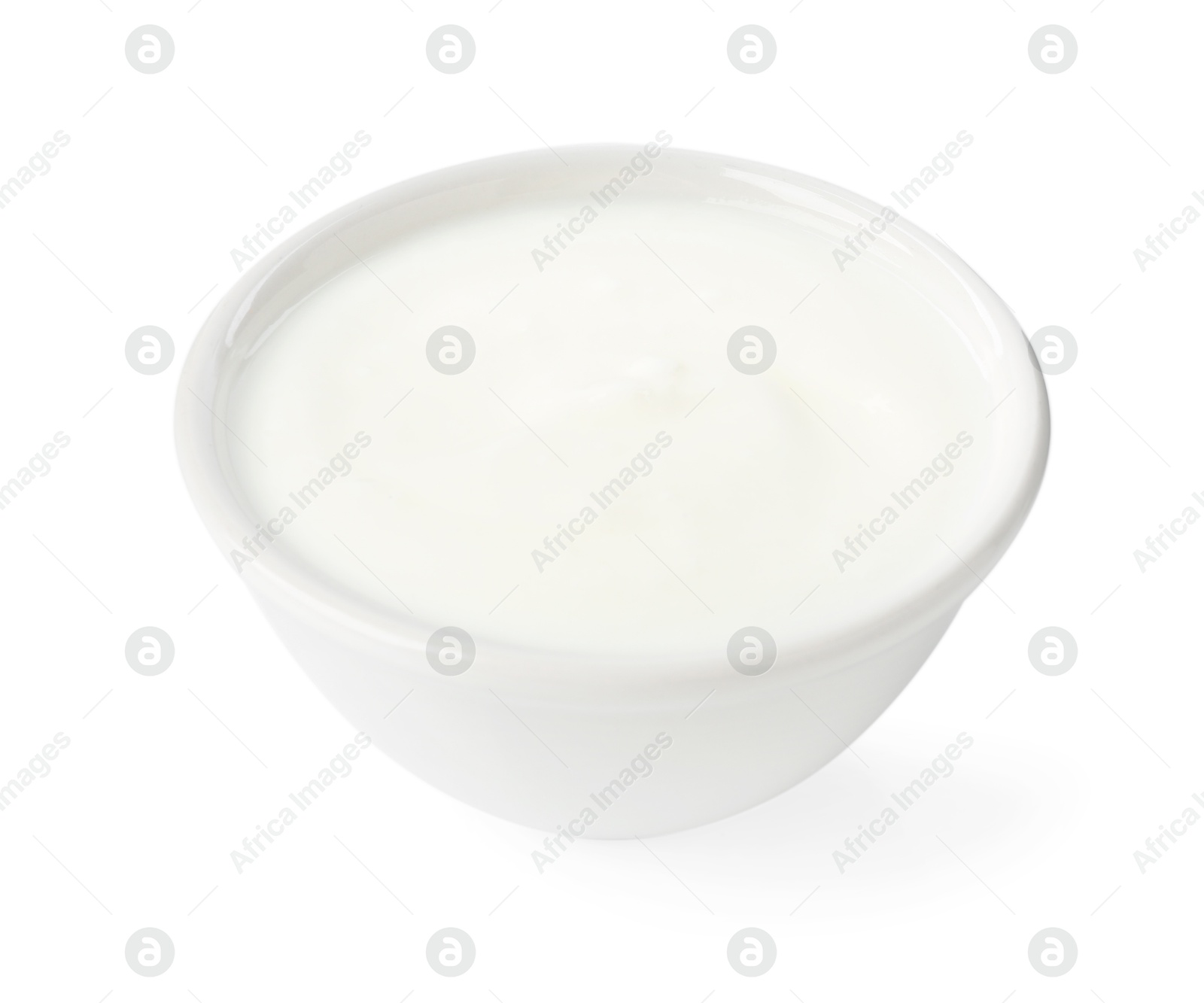 Photo of Delicious yogurt in bowl isolated on white