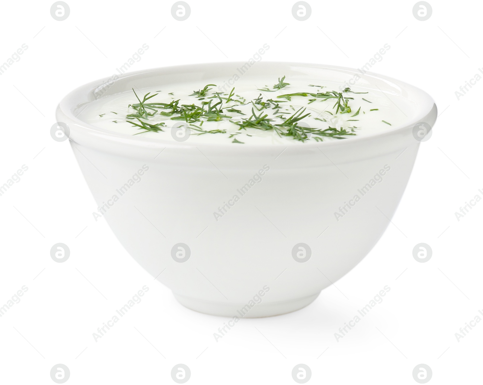 Delicious yogurt with dill in bowl isolated on white Photo of Delicious yogurt with dill in bowl isolated on white