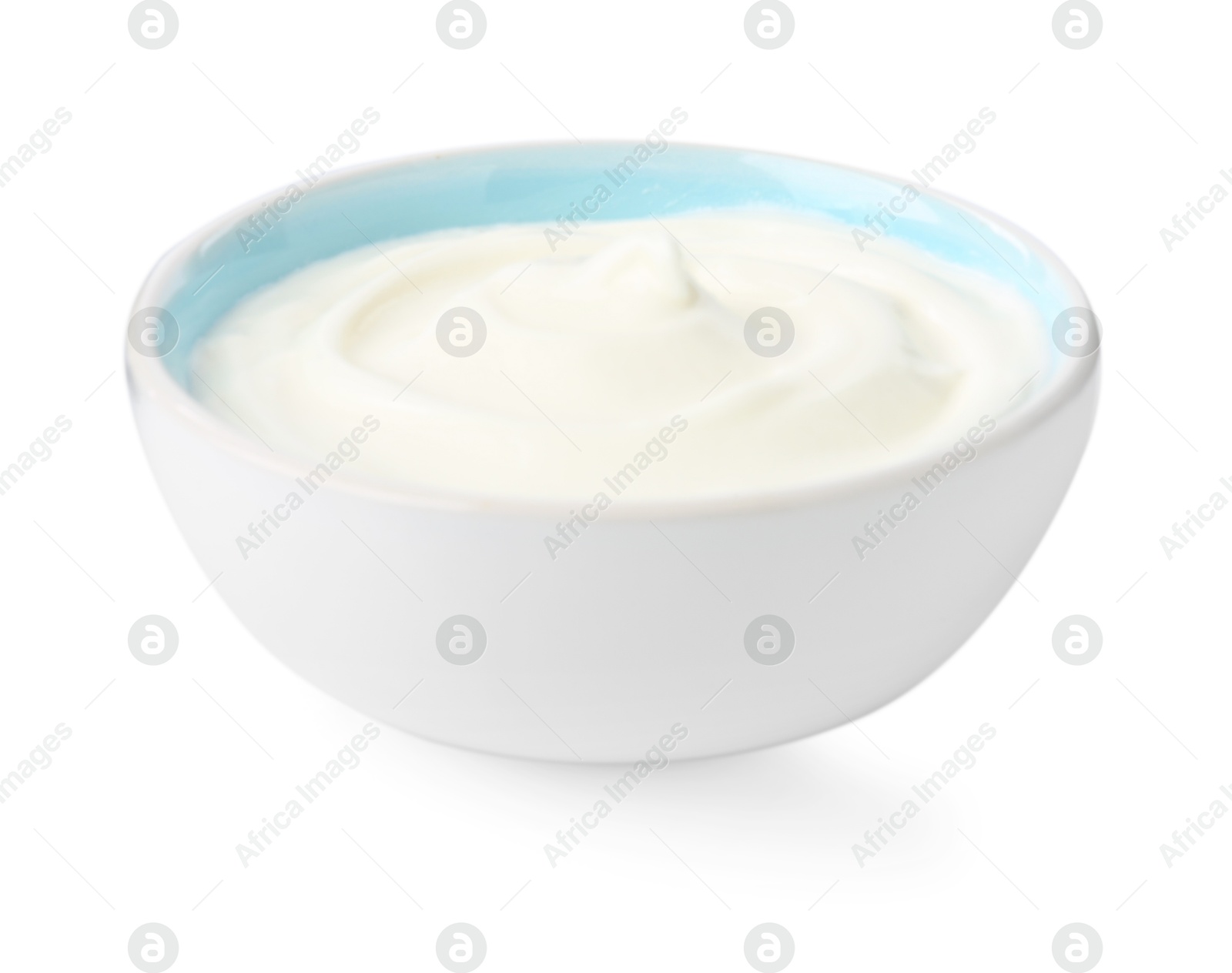 Photo of Delicious yogurt in bowl isolated on white