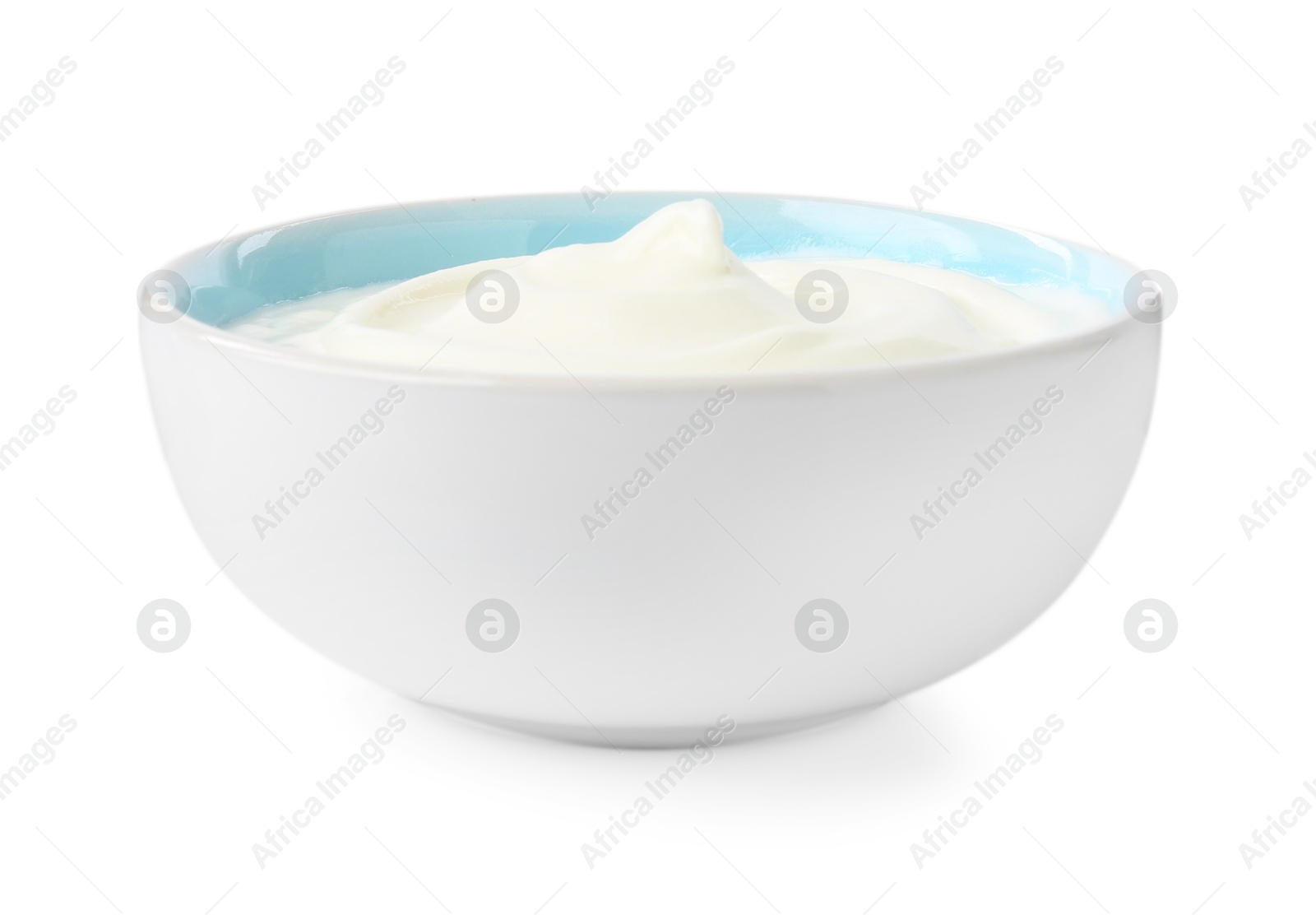 Photo of Delicious yogurt in bowl isolated on white