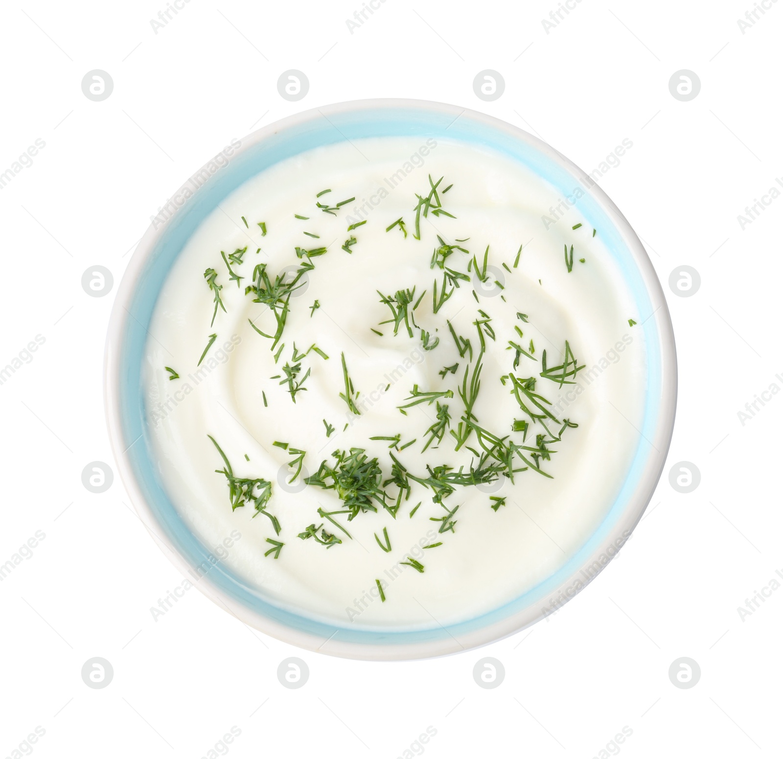 Photo of Delicious yogurt with dill in bowl isolated on white, top view