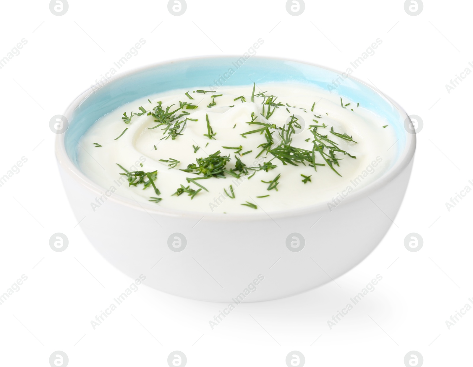 Delicious yogurt with dill in bowl isolated on white Photo of Delicious yogurt with dill in bowl isolated on white