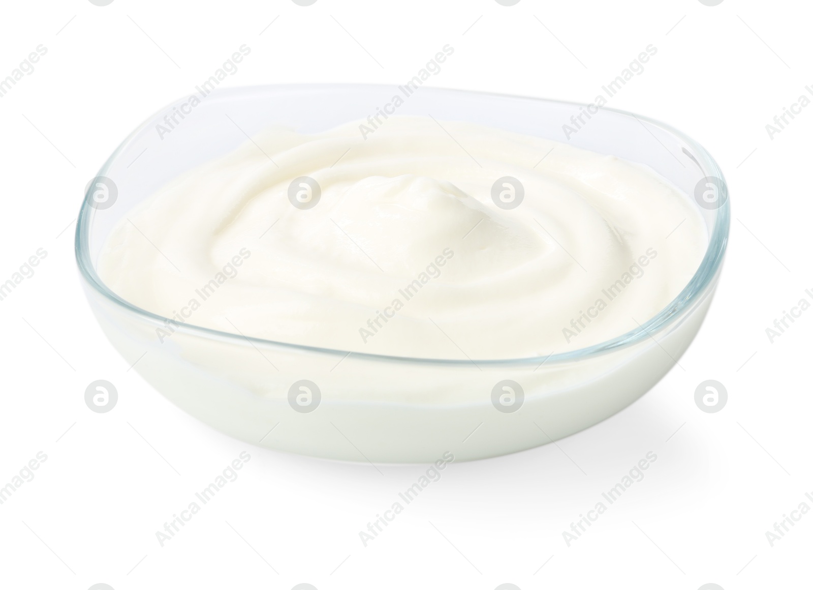 Delicious yogurt in bowl isolated on white Photo of Delicious yogurt in bowl isolated on white