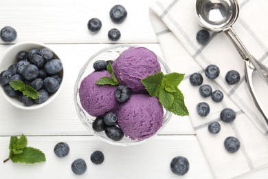 Photo of Tasty sorbet with blueberries and mint in dessert bowl on white wooden table, flat lay