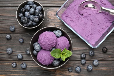Photo of Tasty sorbet with blueberries and mint on wooden table, flat lay