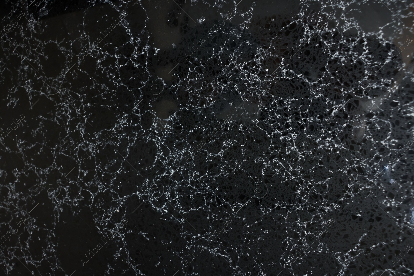 Photo of Texture of black marble surface as background, top view