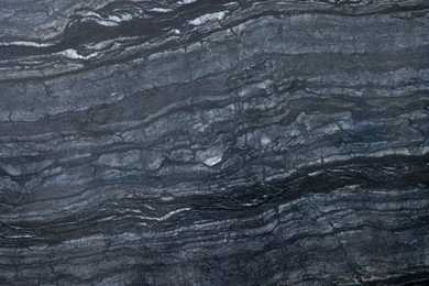 Photo of Texture of dark marble surface as background, top view