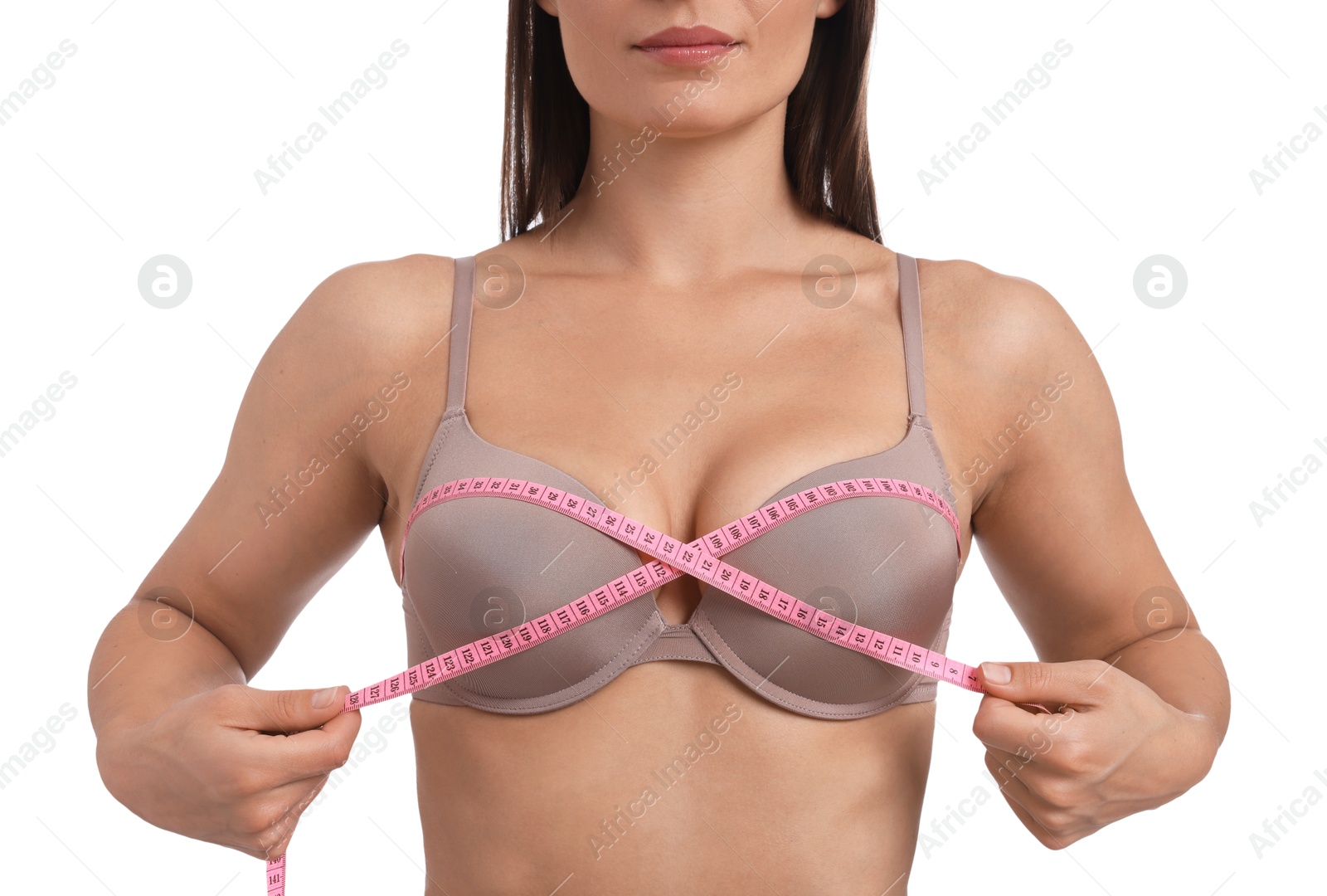 Woman in beautiful bra measuring breast circumference on white background, closeup Photo of Woman in beautiful bra measuring breast circumference on white background, closeup