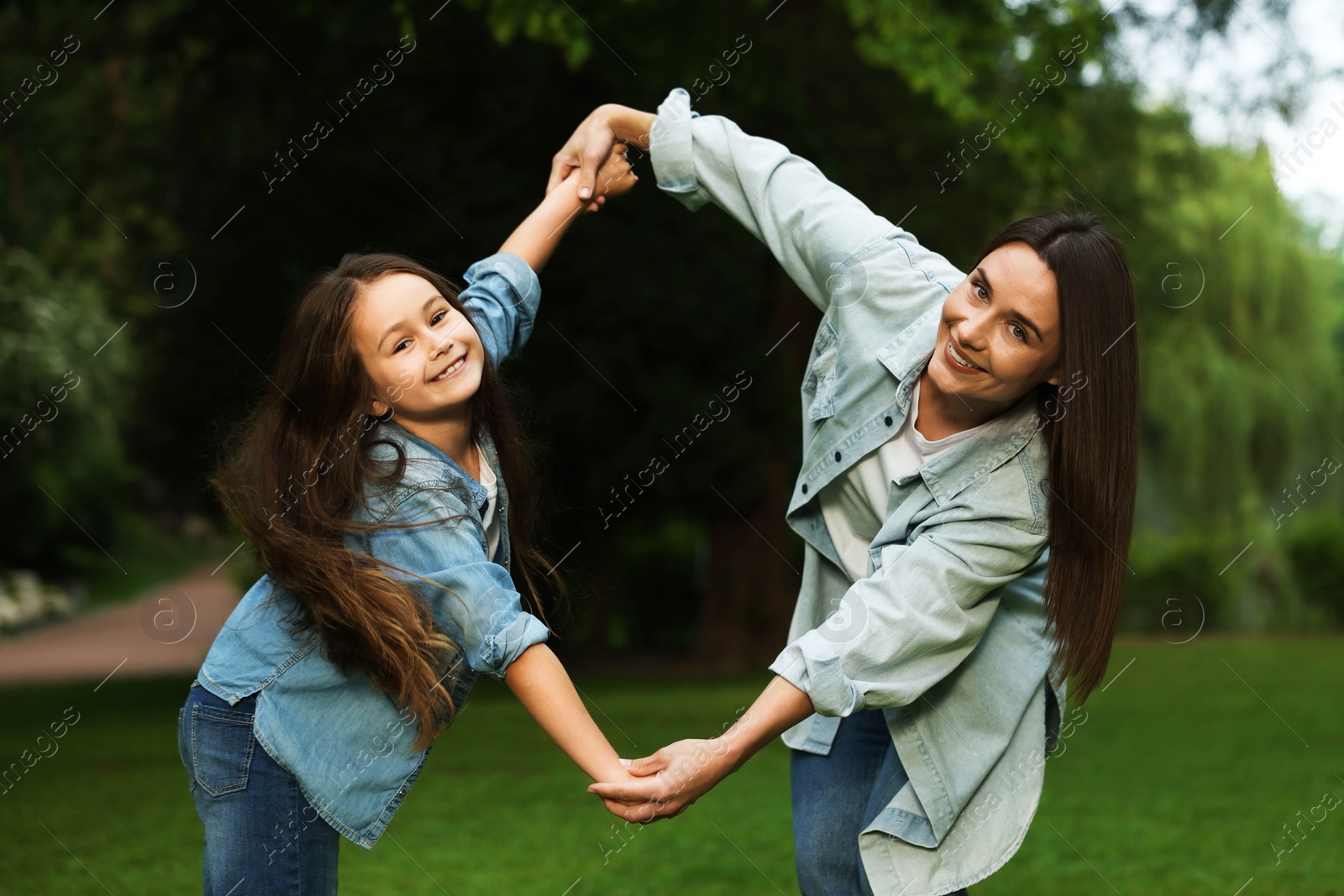 Family getaway. Happy mother and daughter spending time together in park Photo of Family getaway. Happy mother and daughter spending time together in park
