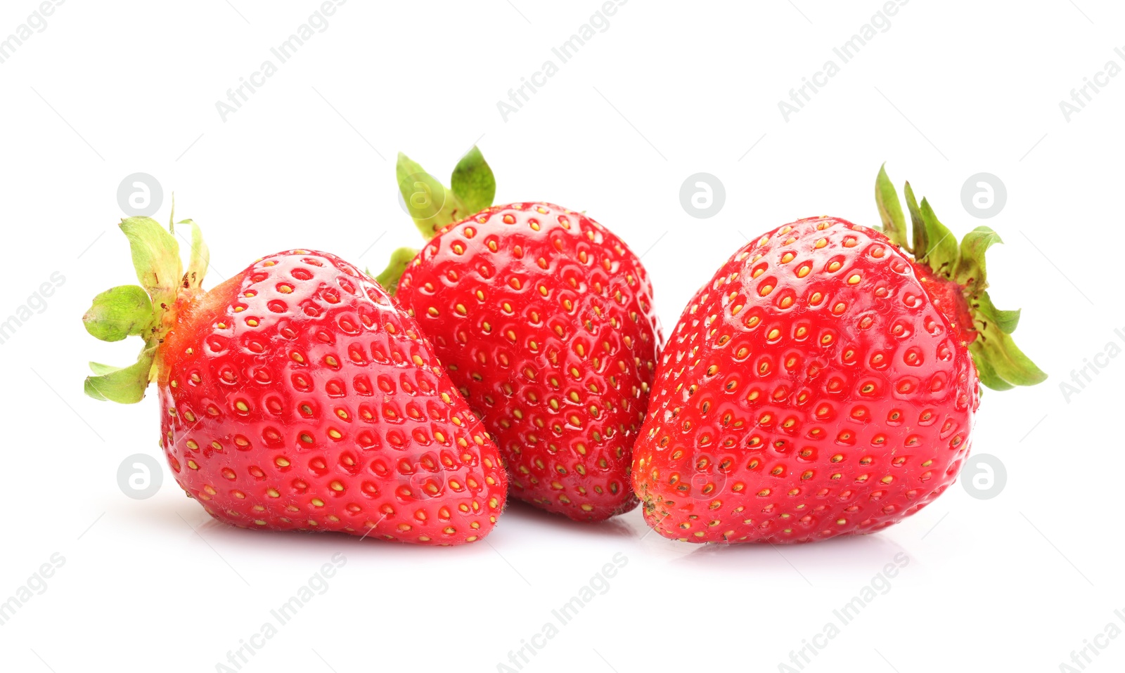 Three fresh ripe strawberries isolated on white Photo of Three fresh ripe strawberries isolated on white