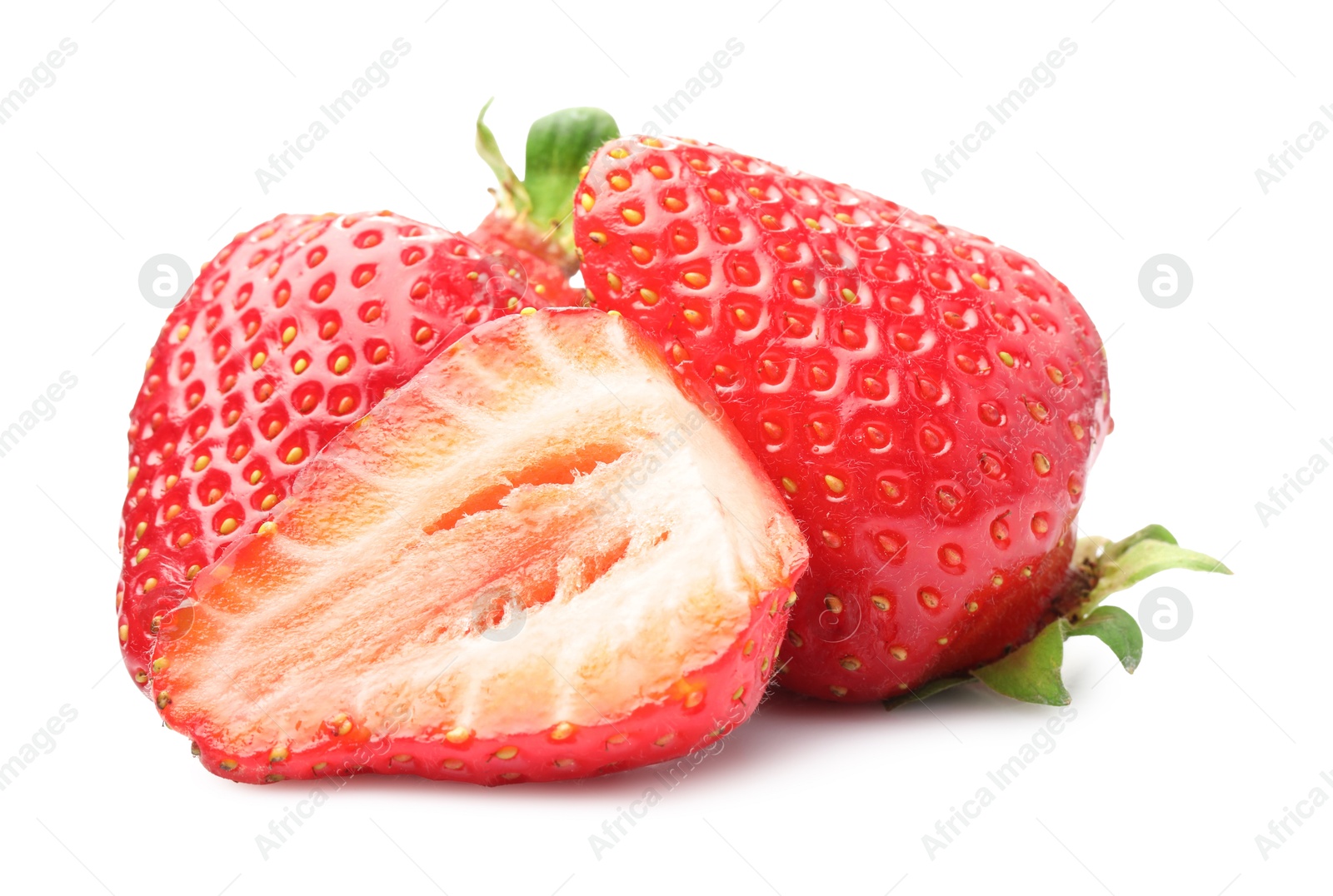 Whole and cut strawberries isolated on white Photo of Whole and cut strawberries isolated on white