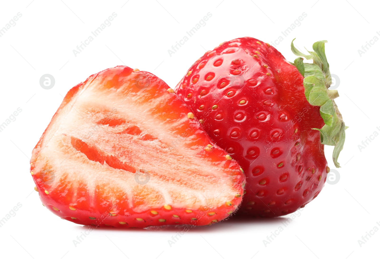 Whole and cut strawberries isolated on white Photo of Whole and cut strawberries isolated on white