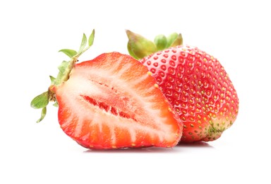 Photo of Whole and cut strawberries isolated on white