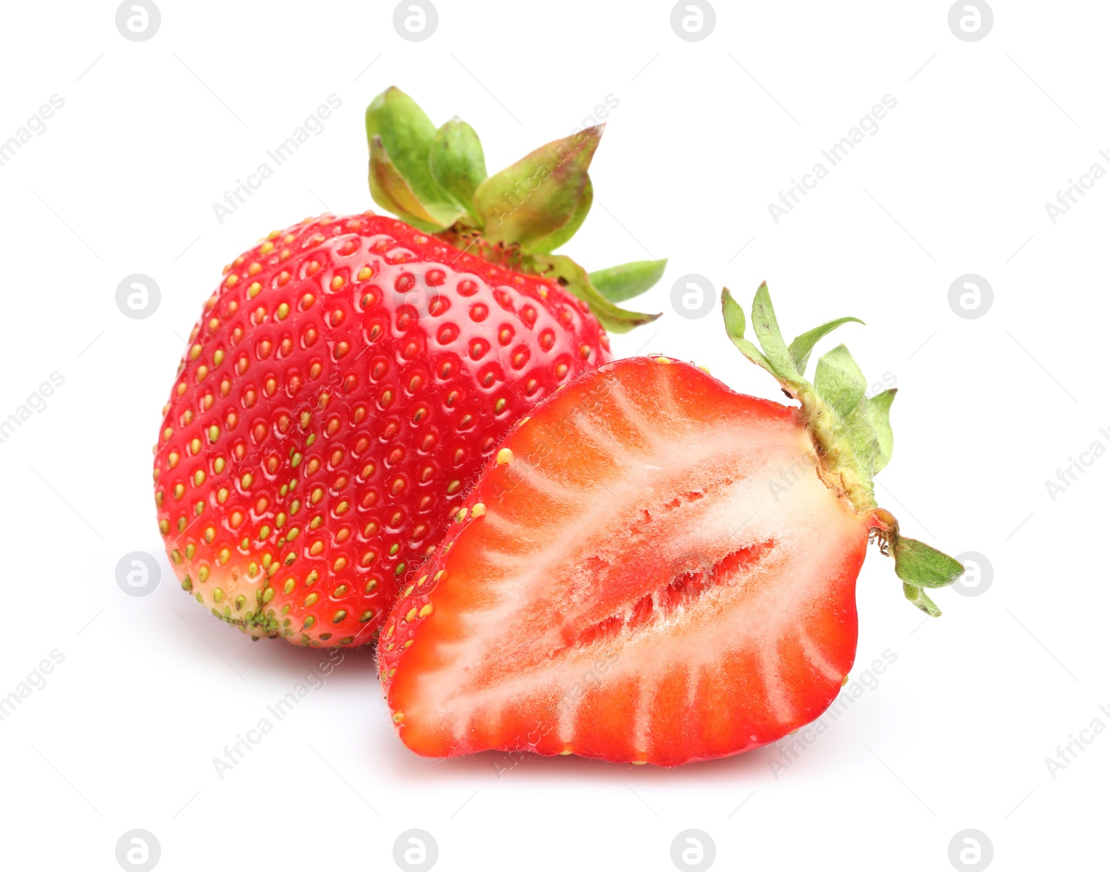 Whole and cut strawberries isolated on white Photo of Whole and cut strawberries isolated on white