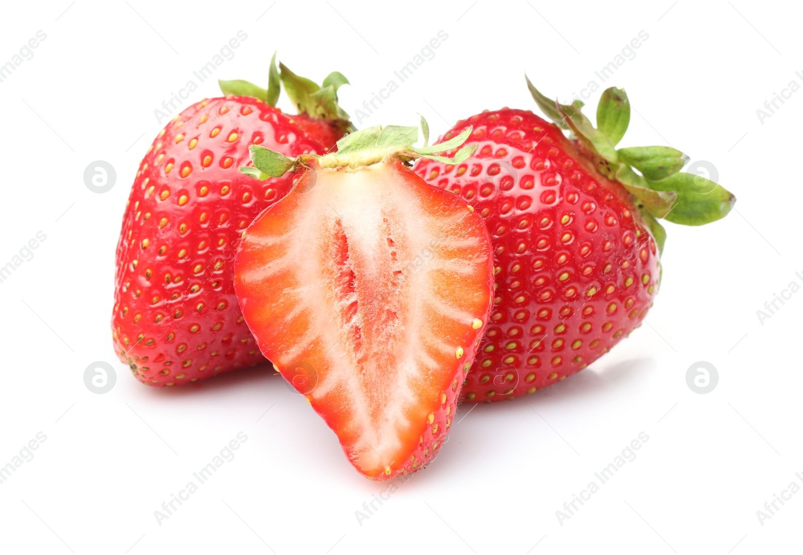 Photo of Whole and cut strawberries isolated on white