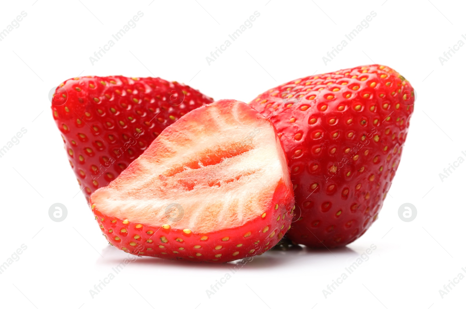 Photo of Whole and cut strawberries isolated on white