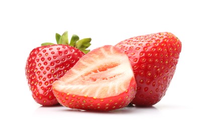 Photo of Whole and cut strawberries isolated on white