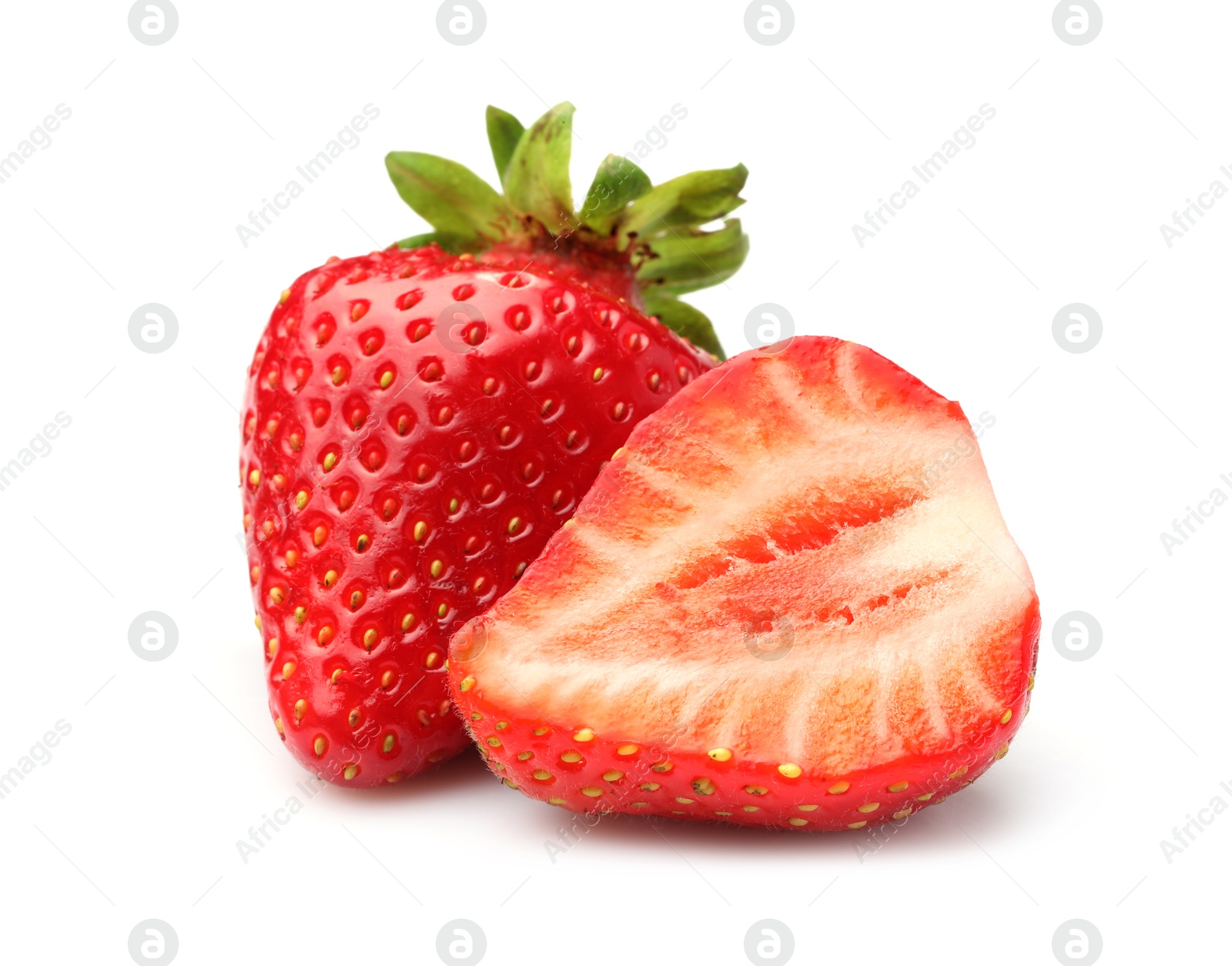 Whole and cut strawberries isolated on white Photo of Whole and cut strawberries isolated on white