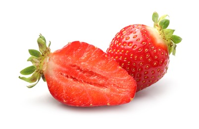 Photo of Whole and cut strawberries isolated on white