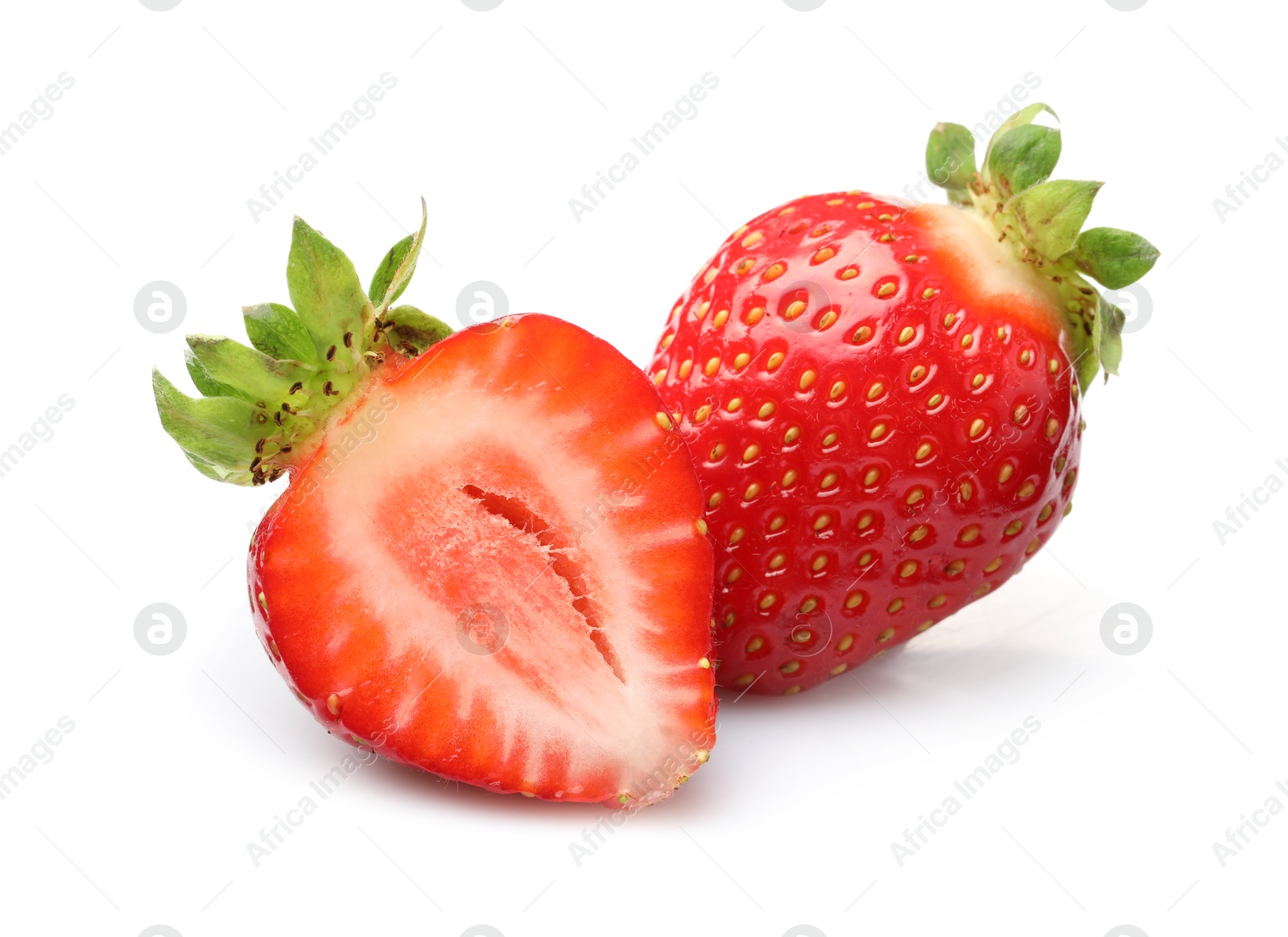 Whole and cut strawberries isolated on white Photo of Whole and cut strawberries isolated on white