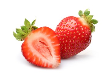 Photo of Whole and cut strawberries isolated on white