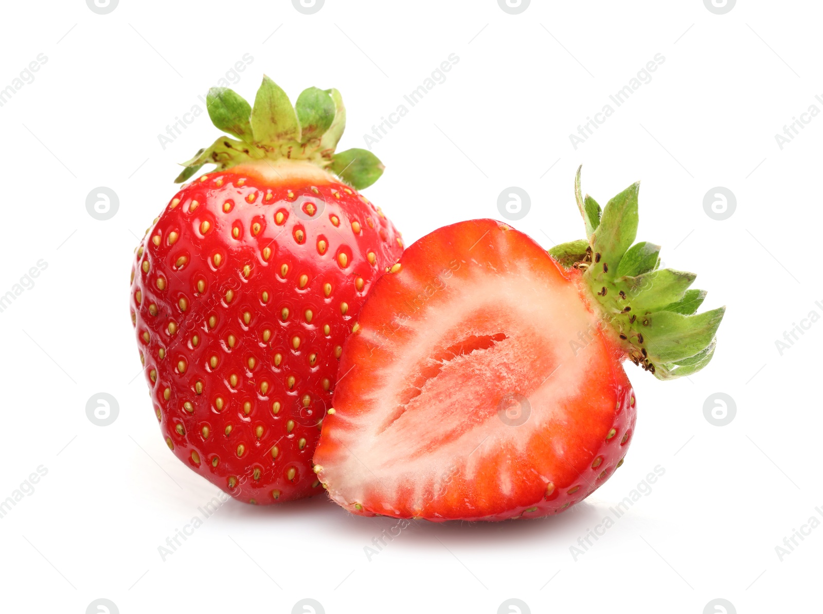 Whole and cut strawberries isolated on white Photo of Whole and cut strawberries isolated on white