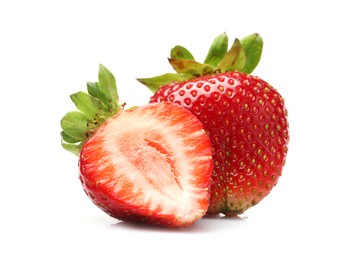 Photo of Whole and cut strawberries isolated on white