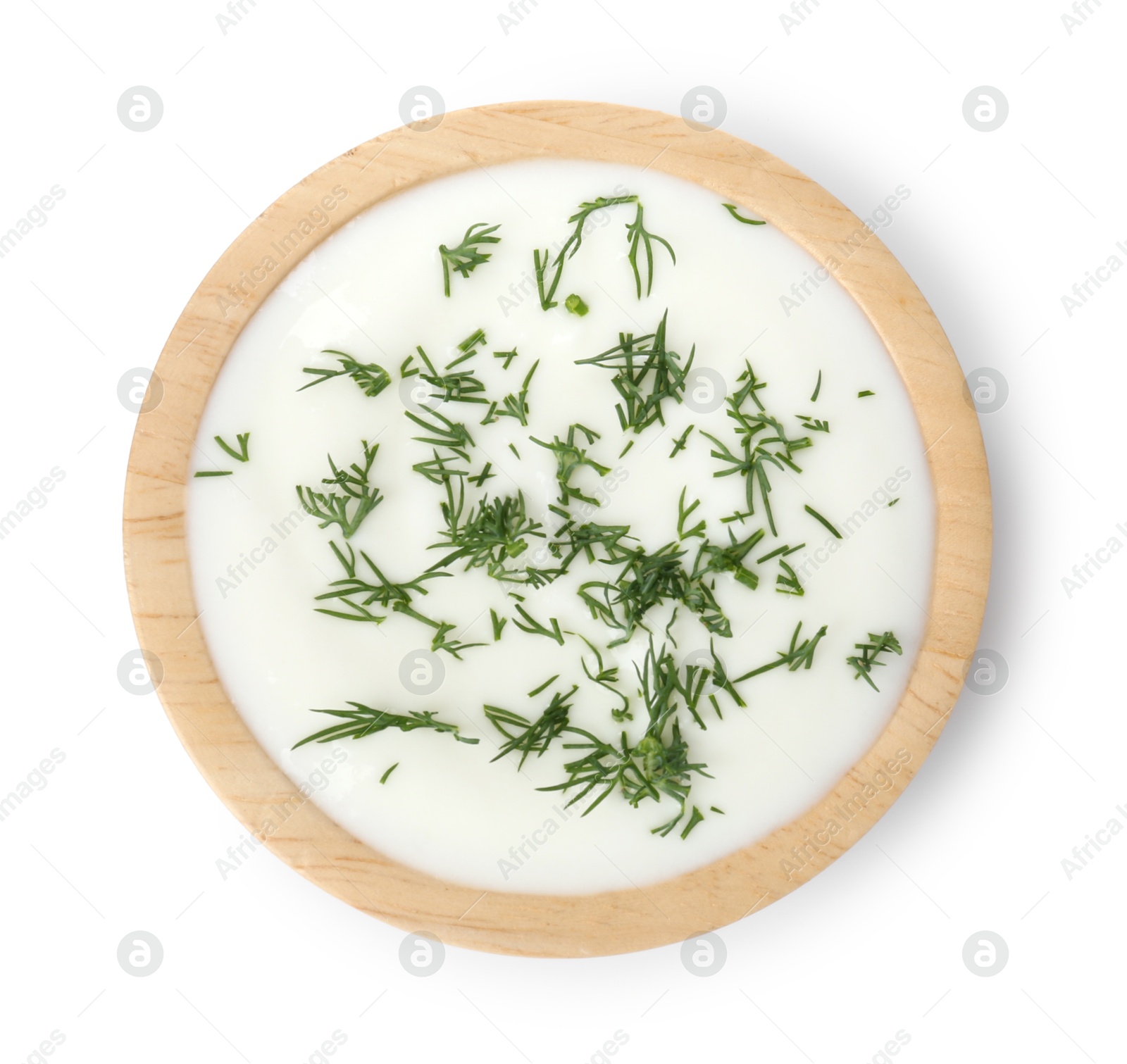Photo of Delicious yogurt with dill in bowl isolated on white, top view
