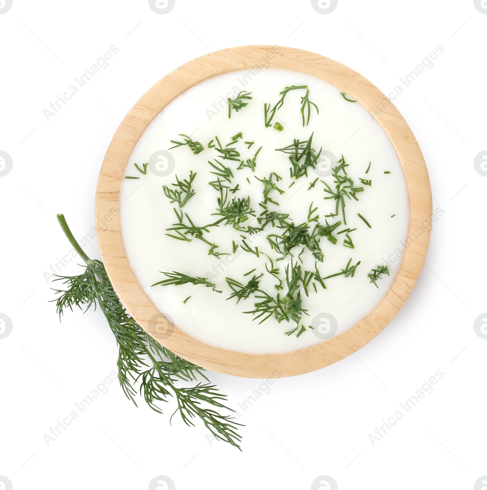Delicious yogurt in bowl and dill isolated on white, top view Photo of Delicious yogurt in bowl and dill isolated on white, top view