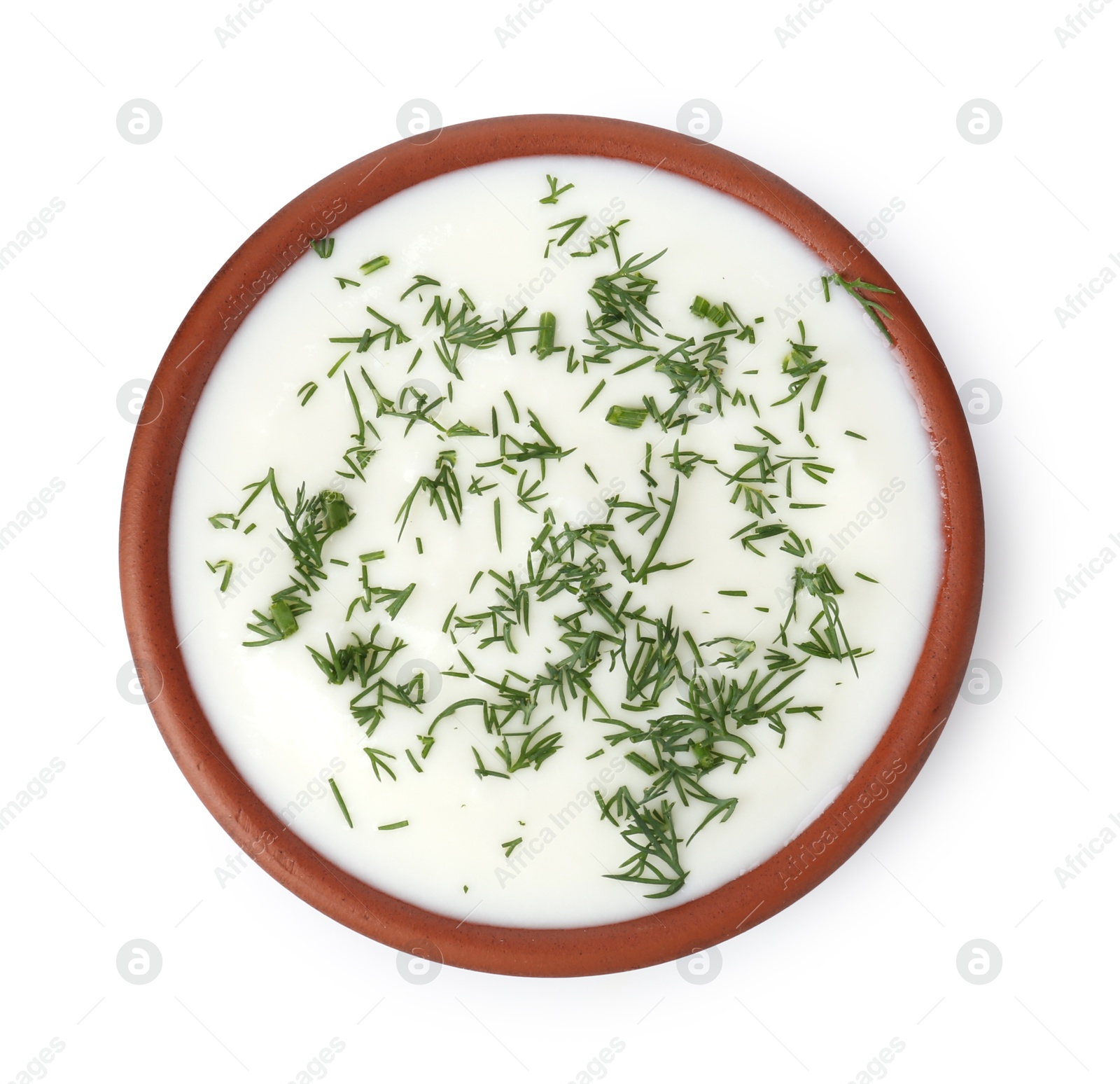 Photo of Delicious yogurt with dill in bowl isolated on white, top view