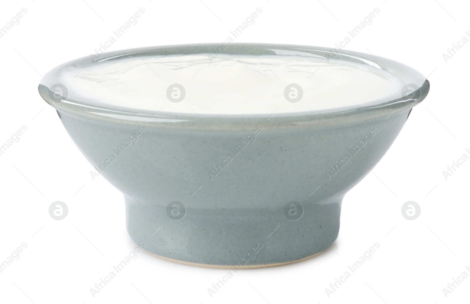 Photo of Delicious yogurt in bowl isolated on white