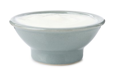Photo of Delicious yogurt in bowl isolated on white