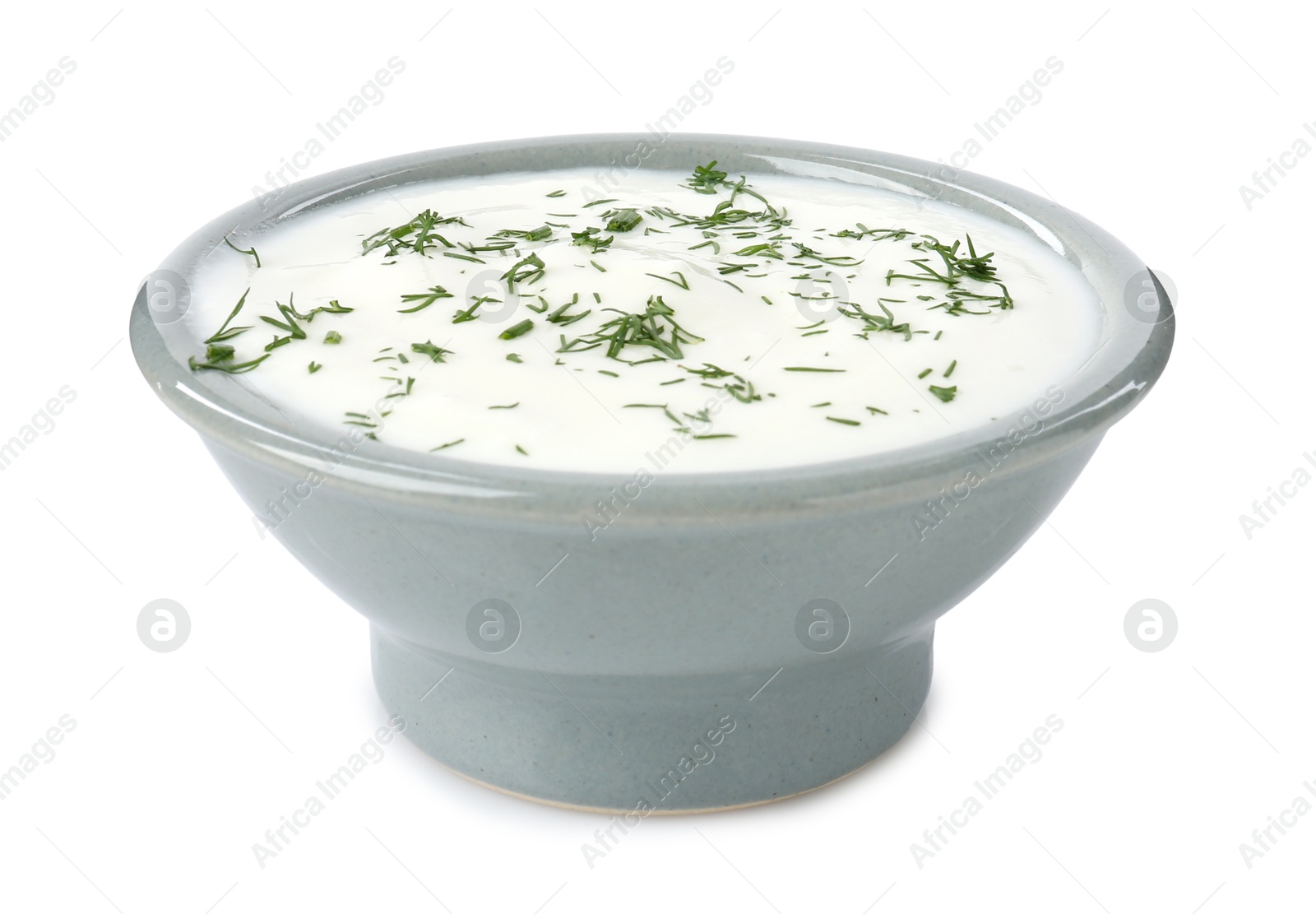 Photo of Delicious yogurt with dill in bowl isolated on white