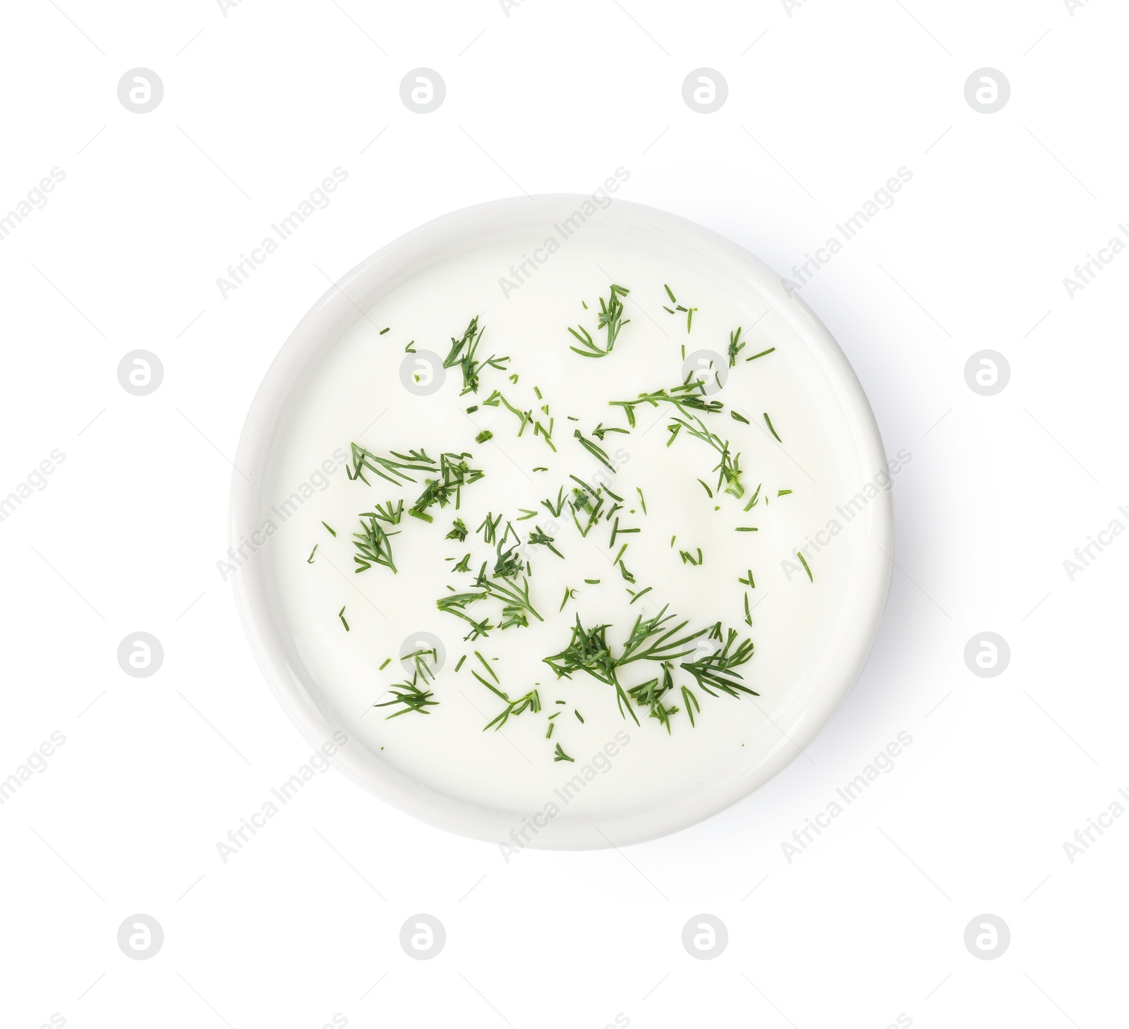 Photo of Delicious yogurt with dill in bowl isolated on white, top view