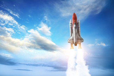 Image of Modern space rocket in beautiful blue sky