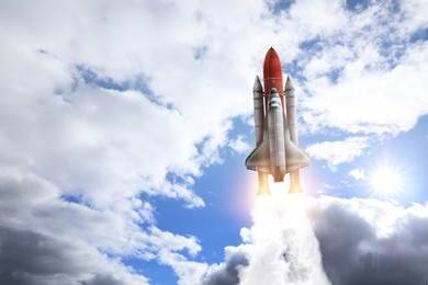 Image of Modern space rocket in beautiful cloudy sky