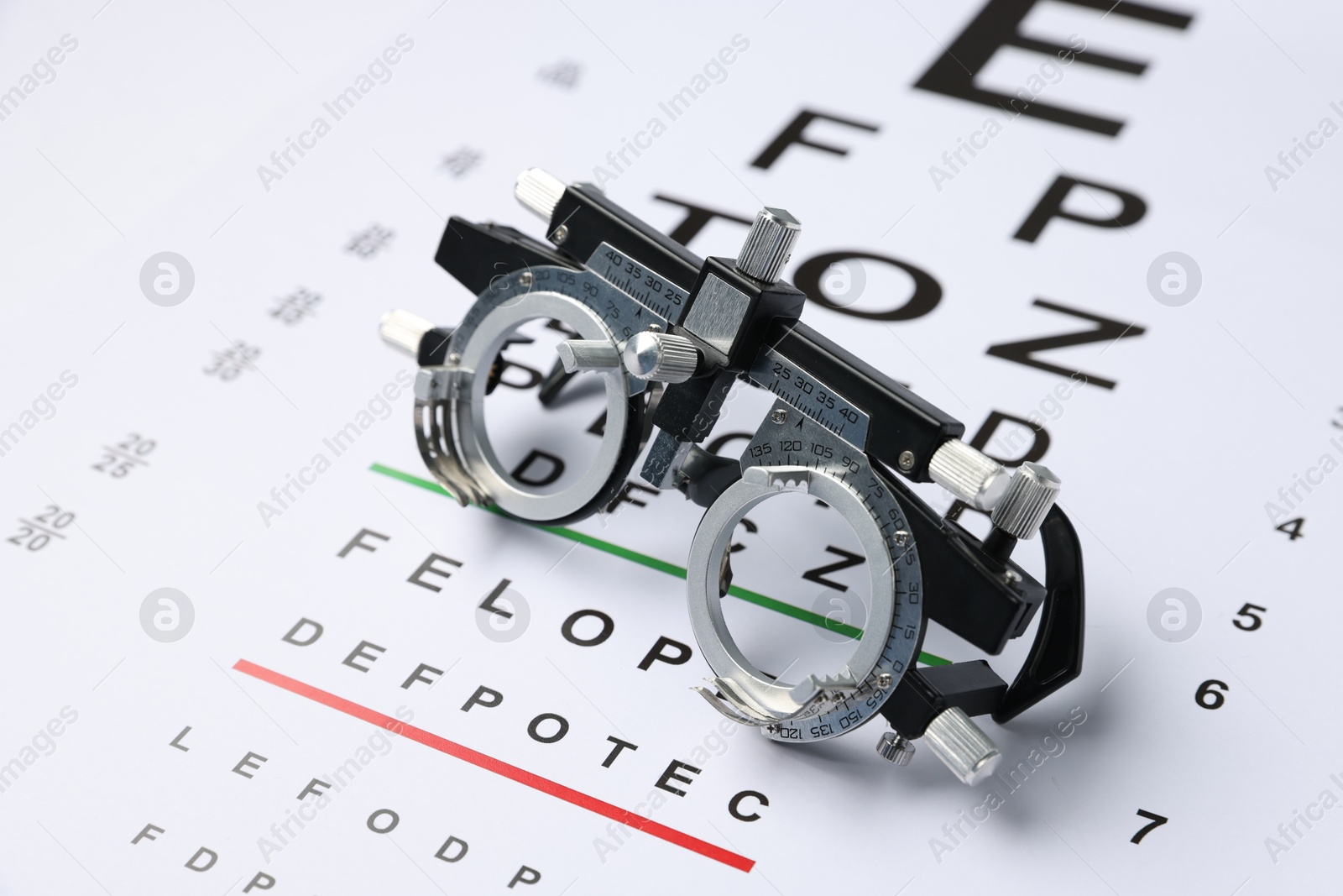Trial frame on vision test chart, closeup Photo of Trial frame on vision test chart, closeup