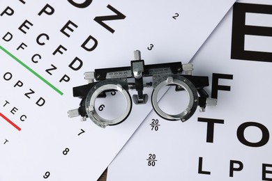 Photo of Vision test charts and trial frame on table, top view