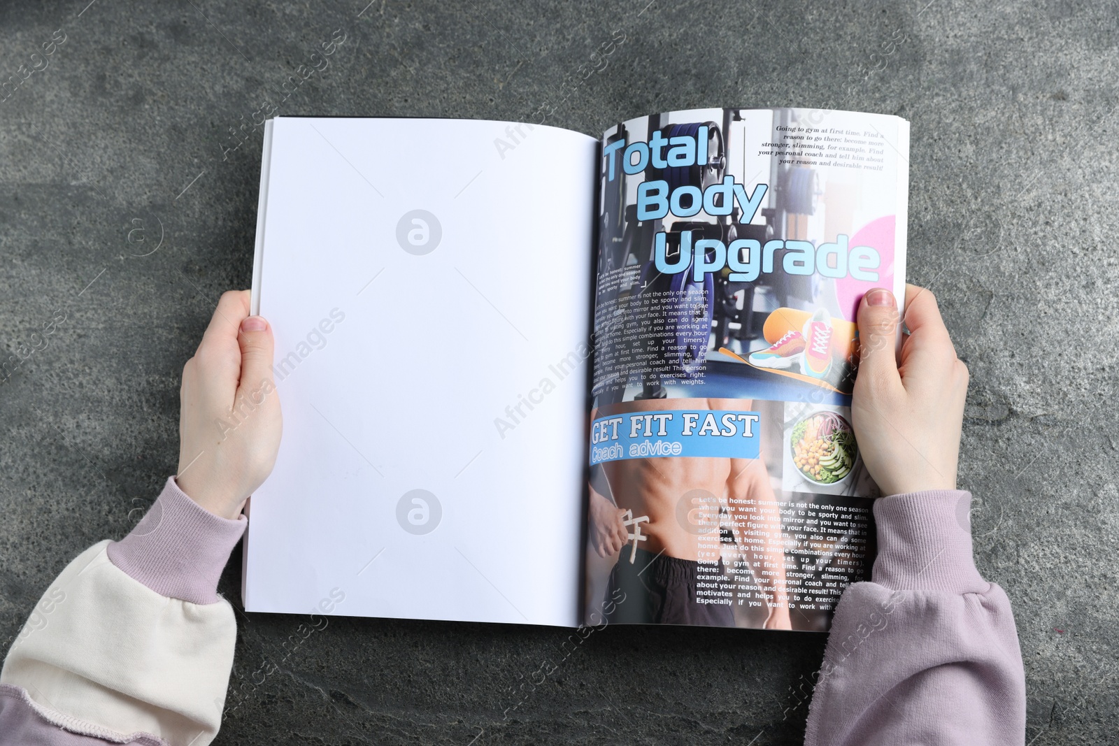 Woman reading magazine at grey table, top view. Mockup for design Photo of Woman reading magazine at grey table, top view. Mockup for design