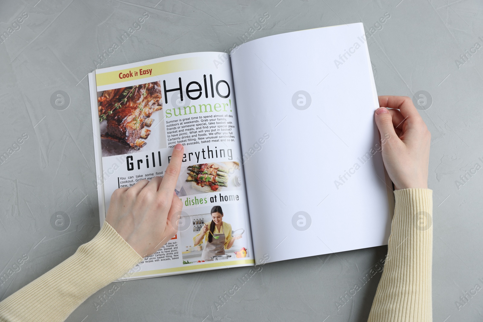 Woman reading magazine at light grey table, top view. Mockup for design Photo of Woman reading magazine at light grey table, top view. Mockup for design
