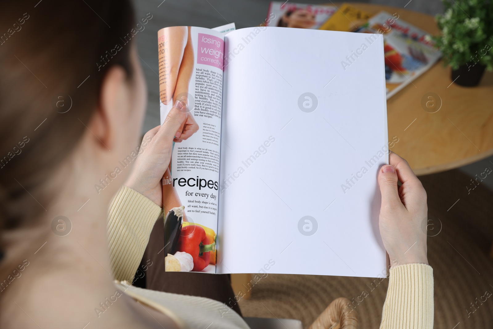 Woman reading magazine indoors, closeup. Mockup for design Photo of Woman reading magazine indoors, closeup. Mockup for design