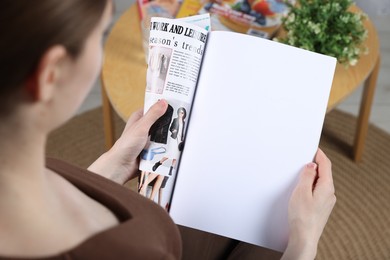 Photo of Woman reading magazine indoors, closeup. Mockup for design
